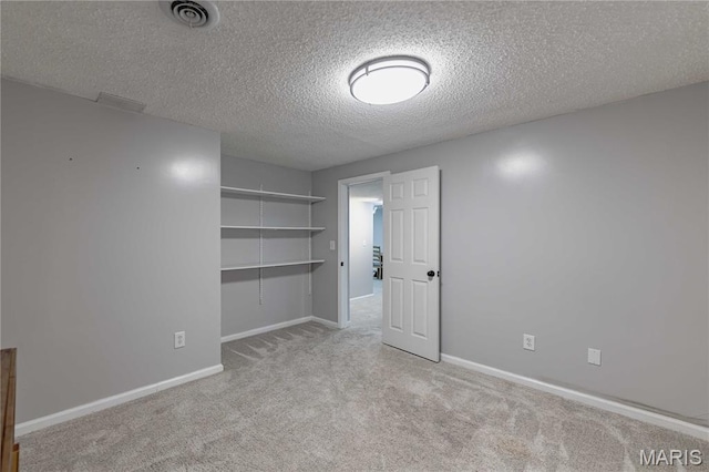 1923 Smizer Mill Rd, Fenton, MO 63026 - unfurnished bedroom featuring carpet and a textured ceiling