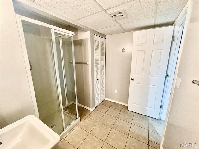 1923 Smizer Mill Rd, Fenton, MO 63026 - bathroom featuring a stall shower, tile patterned flooring, and a drop ceiling