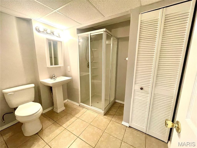 1923 Smizer Mill Rd, Fenton, MO 63026 - bathroom featuring a closet, a stall shower, tile patterned flooring, and a drop ceiling
