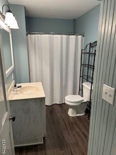 200 N Madison St, Kinmundy, IL 62854 - full bathroom featuring vanity, wood finished floors, and curtained shower