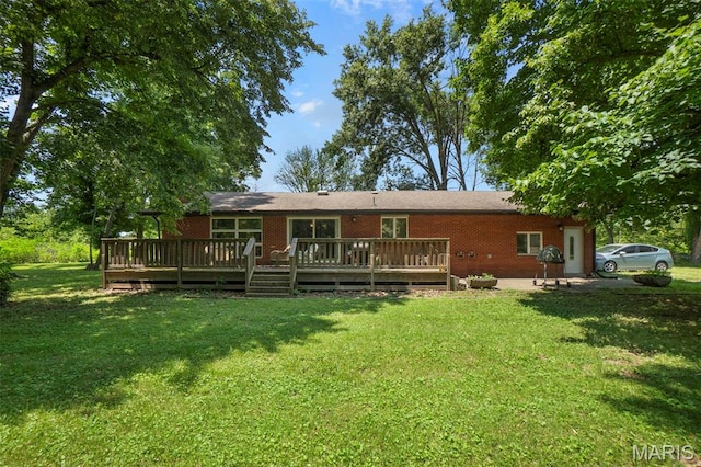 17999 State Highway 177, Jackson, MO 63755 - rear view of house featuring brick siding, a lawn, and a deck