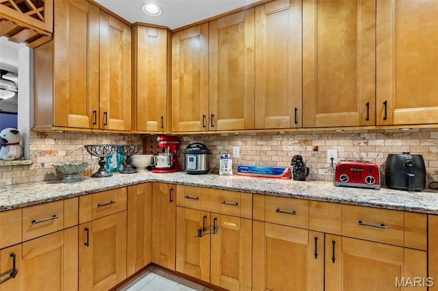 17999 State Highway 177, Jackson, MO 63755 - kitchen with backsplash and light stone countertops