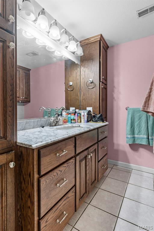 17999 State Highway 177, Jackson, MO 63755 - bathroom with vanity and tile patterned flooring