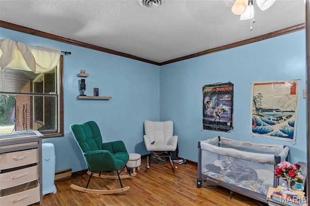 17999 State Highway 177, Jackson, MO 63755 - bedroom with ornamental molding, wood finished floors, a textured ceiling, and a baseboard radiator
