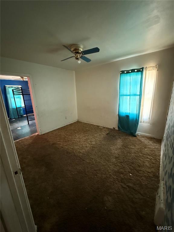 8030 Aline Ave, Berkeley, MO 63134 - unfurnished room featuring carpet floors and a ceiling fan