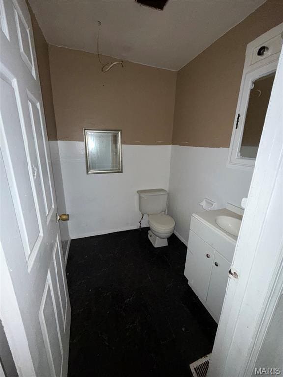 8030 Aline Ave, Berkeley, MO 63134 - bathroom with vanity and toilet