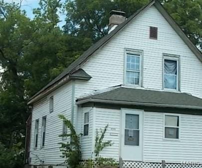 4943 Genevieve Ave, Saint Louis, MO 63120 - view of side of home with a chimney