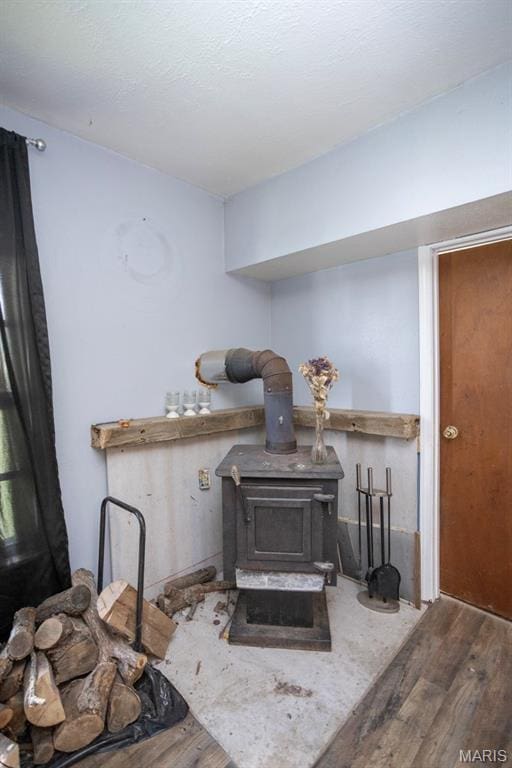 200 S Frisco, Crocker, MO 65452 - detailed view of a wood stove and wood finished floors
