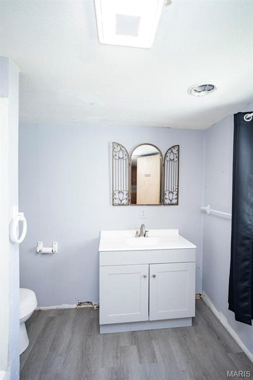 200 S Frisco, Crocker, MO 65452 - bathroom featuring wood finished floors and vanity