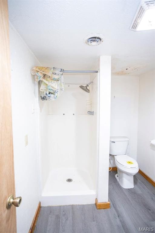 200 S Frisco, Crocker, MO 65452 - full bathroom featuring wood finished floors and a shower stall