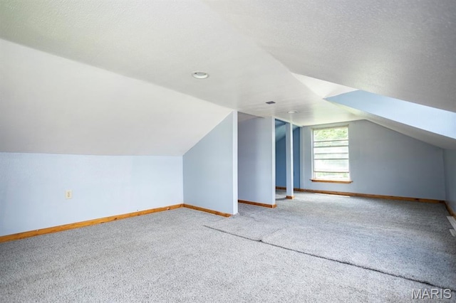 200 S Frisco, Crocker, MO 65452 - bonus room featuring carpet, lofted ceiling, and a textured ceiling