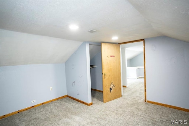 200 S Frisco, Crocker, MO 65452 - bonus room featuring vaulted ceiling, carpet, a textured ceiling, and recessed lighting