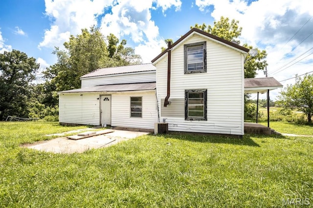 200 S Frisco, Crocker, MO 65452 - rear view of property with a lawn and a metal roof
