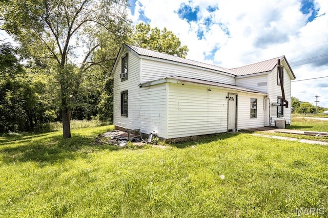 200 S Frisco, Crocker, MO 65452 - view of side of home featuring a lawn and a metal roof