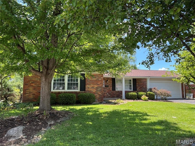 2941 Elmcrest Dr, Saint Charles, MO 63301 - view of front facade with an attached garage, brick siding, a front lawn, and driveway