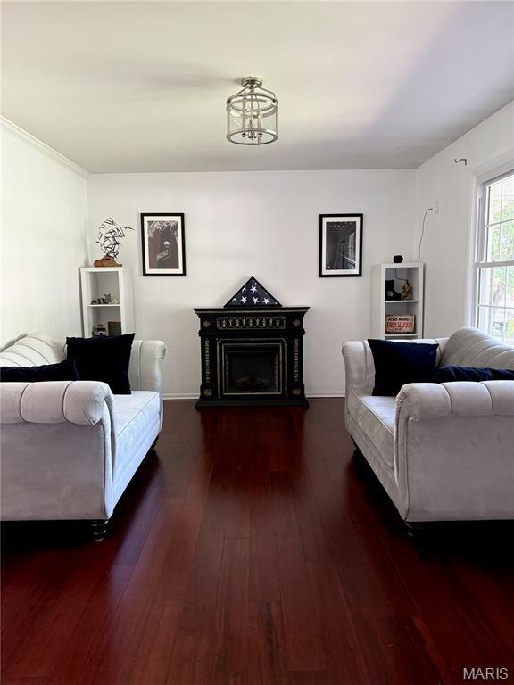 2941 Elmcrest Dr, Saint Charles, MO 63301 - living room featuring hardwood / wood-style flooring and a fireplace with raised hearth