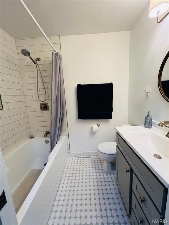 2941 Elmcrest Dr, Saint Charles, MO 63301 - full bathroom with vanity and shower / bath combo with shower curtain