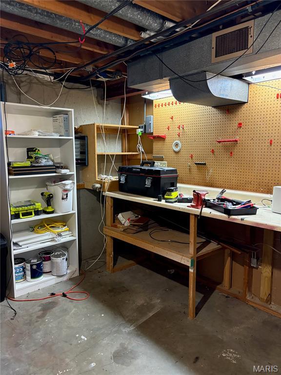 2941 Elmcrest Dr, Saint Charles, MO 63301 - unfinished below grade area featuring a workshop area