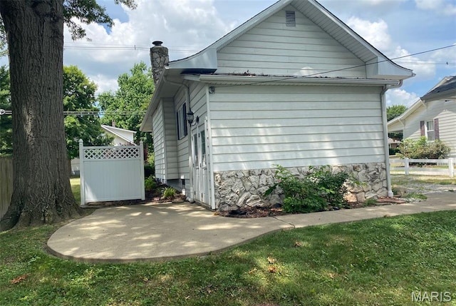 464 S Mill St, Nashville, IL 62263 - view of property exterior with a chimney and a patio area