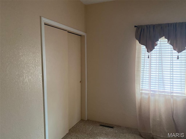 464 S Mill St, Nashville, IL 62263 - unfurnished bedroom featuring a closet and carpet flooring