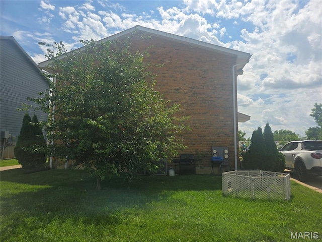1331 Dartmouth Ct, Saint Charles, MO 63303 - view of side of home with brick siding and a yard