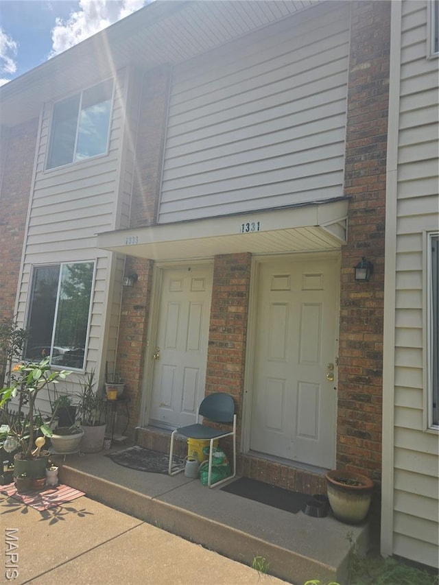 1331 Dartmouth Ct, Saint Charles, MO 63303 - view of exterior entry featuring brick siding
