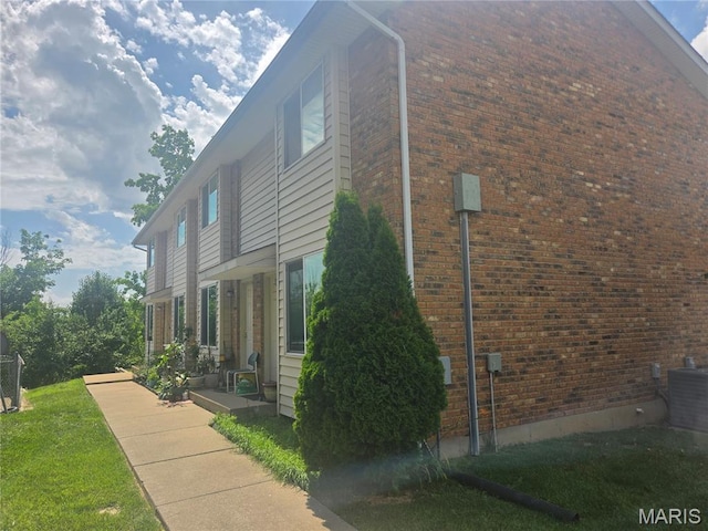 1331 Dartmouth Ct, Saint Charles, MO 63303 - view of home's exterior with brick siding and a central AC unit