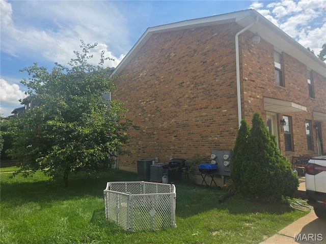 1331 Dartmouth Ct, Saint Charles, MO 63303 - view of side of property with brick siding and a lawn