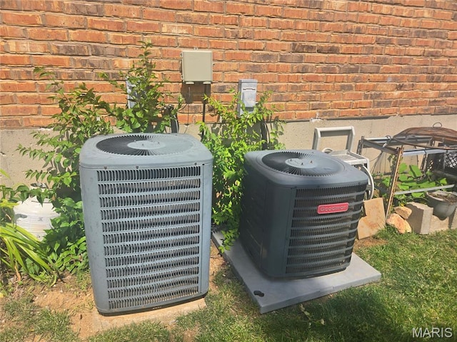 1331 Dartmouth Ct, Saint Charles, MO 63303 - exterior view of a cooling unit and brick siding