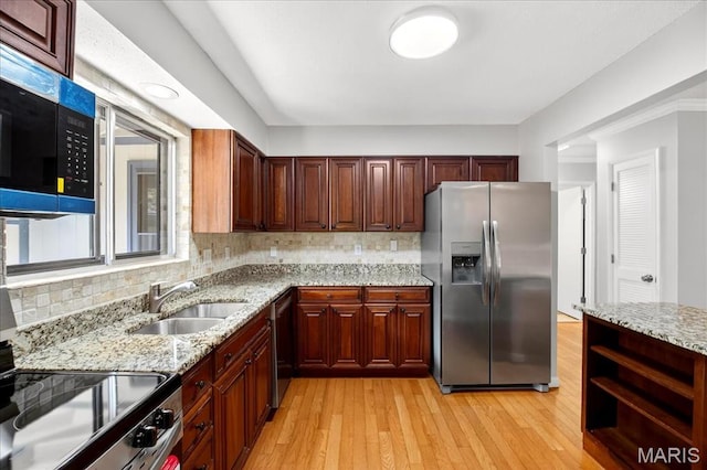 775 Knickerbacker Dr, Manchester, MO 63021 - kitchen featuring stainless steel appliances, light wood finished floors, decorative backsplash, and light stone countertops