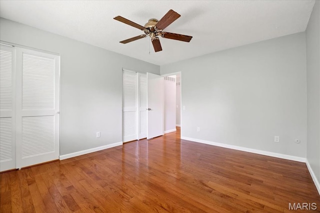 775 Knickerbacker Dr, Manchester, MO 63021 - unfurnished bedroom featuring wood finished floors and a ceiling fan