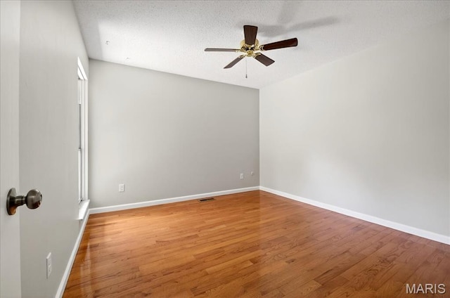 775 Knickerbacker Dr, Manchester, MO 63021 - spare room featuring a ceiling fan, light wood finished floors, and a textured ceiling