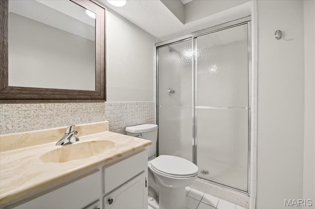 775 Knickerbacker Dr, Manchester, MO 63021 - full bathroom featuring vanity, a shower stall, tile patterned floors, tile walls, and a wainscoted wall