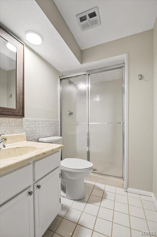 775 Knickerbacker Dr, Manchester, MO 63021 - bathroom with vanity, a stall shower, tile patterned floors, and tile walls