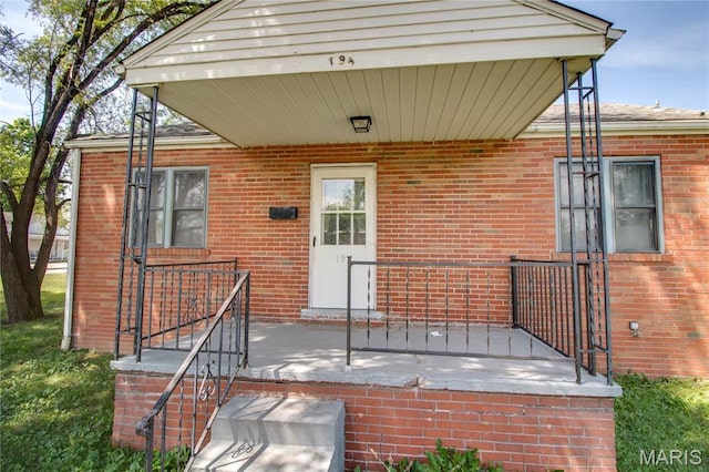 194 S Pence St, East Alton, IL 62024 - doorway to property with brick siding