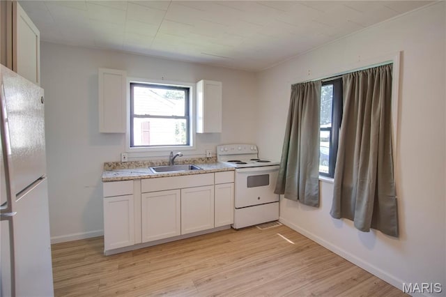 194 S Pence St, East Alton, IL 62024 - kitchen featuring white appliances, light wood-type flooring, and white cabinetry