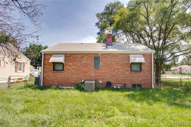 194 S Pence St, East Alton, IL 62024 - rear view of house featuring brick siding and a chimney