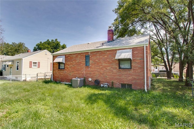 194 S Pence St, East Alton, IL 62024 - rear view of house featuring a chimney and brick siding