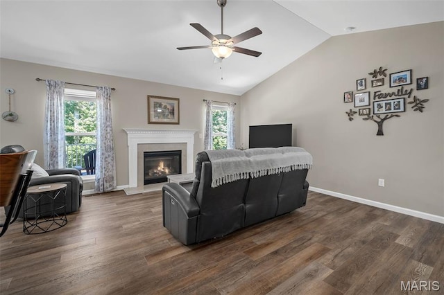139 Brookview Way Dr, Ofallon, MO 63366 - living room with ceiling fan, vaulted ceiling, healthy amount of natural light, dark wood-style floors, and a glass covered fireplace