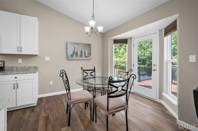 139 Brookview Way Dr, Ofallon, MO 63366 - dining area with dark wood finished floors, a chandelier, and lofted ceiling