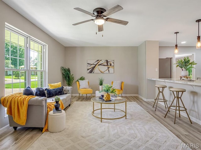 5 Chalet Ct, Fairview Heights, IL 62208 - living area with light wood-style floors and a ceiling fan
