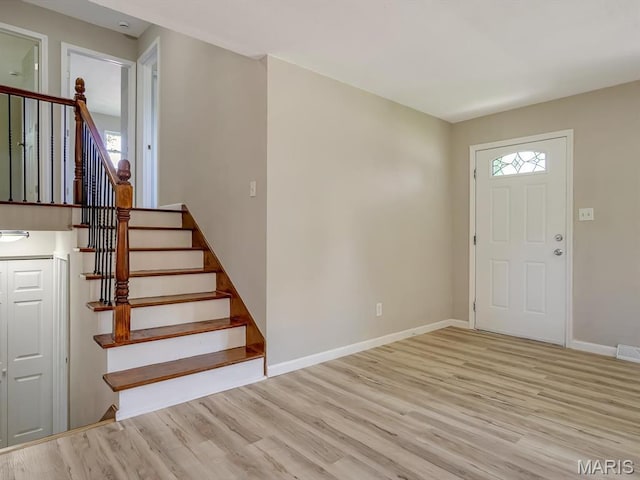 5 Chalet Ct, Fairview Heights, IL 62208 - entrance foyer featuring healthy amount of natural light, wood finished floors, and stairs