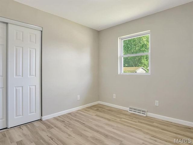 5 Chalet Ct, Fairview Heights, IL 62208 - empty room with light wood-style floors and baseboards
