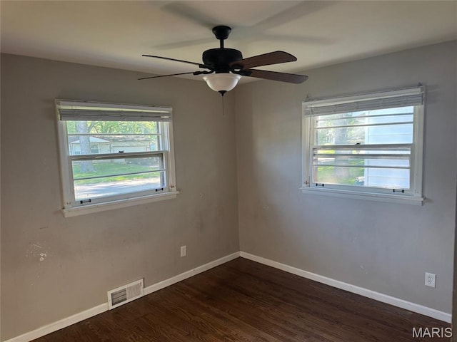 1433 Farmview Ave, Spanish Lake Township, MO 63138 - spare room with dark wood finished floors and a ceiling fan