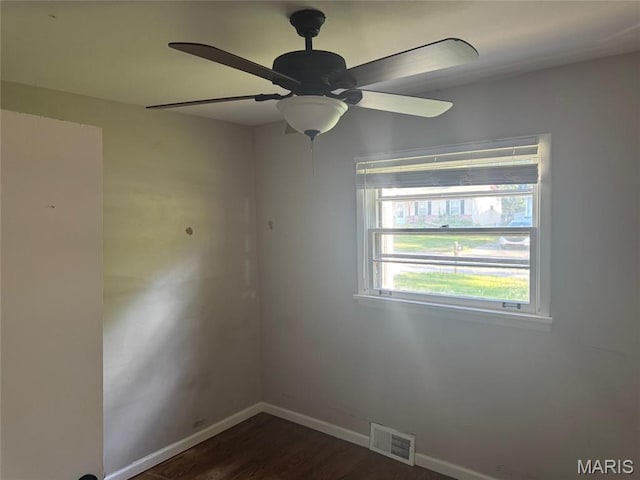 1433 Farmview Ave, Spanish Lake Township, MO 63138 - spare room with a ceiling fan and dark wood-style flooring