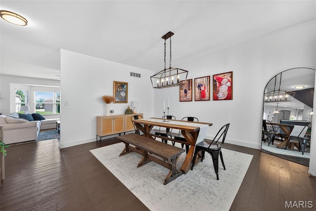 231 Flint Brook Dr, Ofallon, MO 63366 - dining room featuring a chandelier and dark wood finished floors