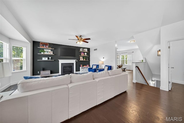 231 Flint Brook Dr, Ofallon, MO 63366 - living room with a glass covered fireplace, dark wood finished floors, and ceiling fan