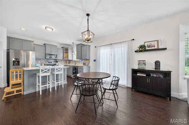 231 Flint Brook Dr, Ofallon, MO 63366 - dining space featuring dark wood-style flooring, recessed lighting, and a chandelier