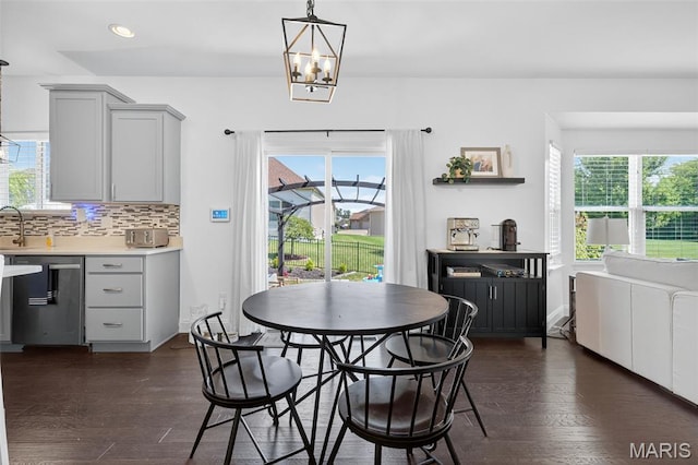 231 Flint Brook Dr, Ofallon, MO 63366 - dining area with dark wood-type flooring, recessed lighting, and a chandelier