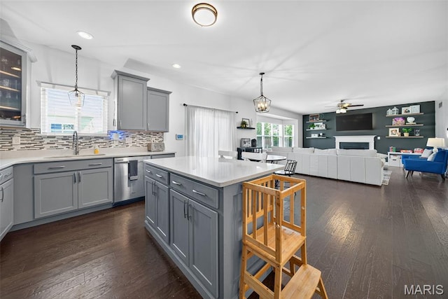 231 Flint Brook Dr, Ofallon, MO 63366 - kitchen with gray cabinetry, dishwasher, ceiling fan, light countertops, and recessed lighting